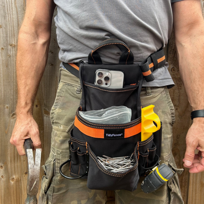 TidyFence tool belt in use for precise feather edge fencing installation.